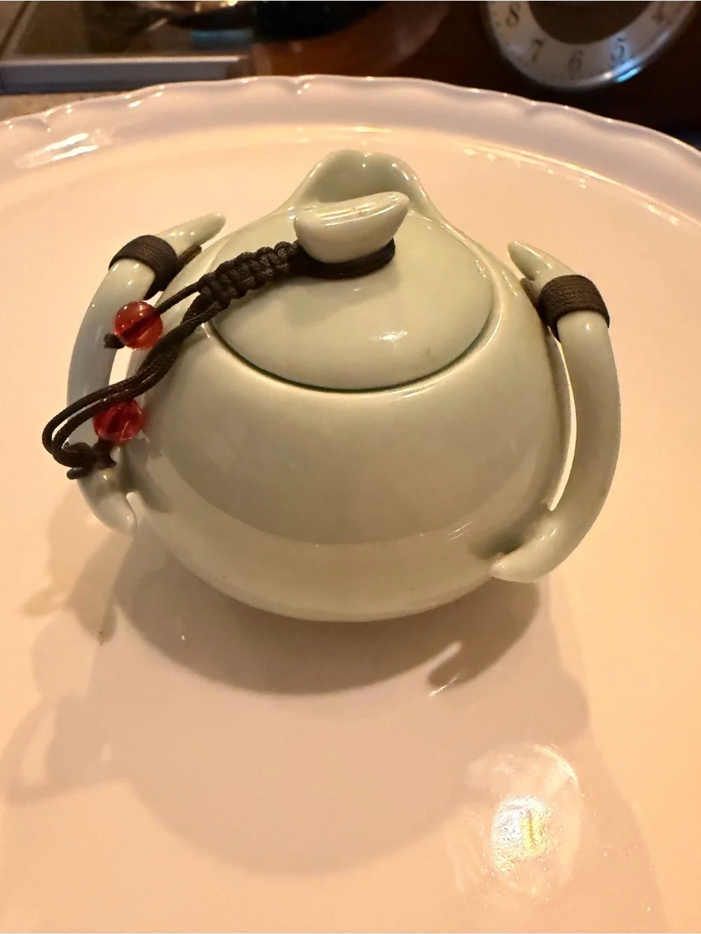 Ceramic Pale Green Mini Teapot with Integrates Strainer,Brown Cord and Red Beads